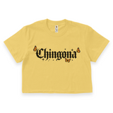 Yellow crop top with 'Chingona' text and butterfly graphics on a white background
