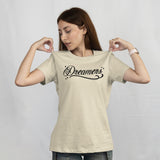 'Dreamers: Born From Dreams That Crossed Borders' Unisex T-Shirt - Ivory - Premium Cotton