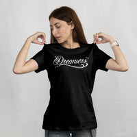 'Dreamers: Born From Dreams That Crossed Borders' Unisex T-Shirt - Black - Premium Cotton